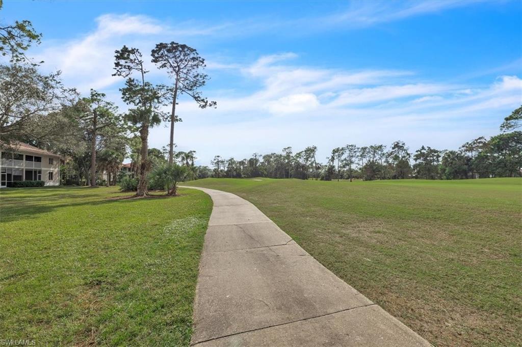 8075 Tiger Cove, Unit 1706 Naples, FL 34113 - Photo 39 of 50 View of home's community featuring a view of golf