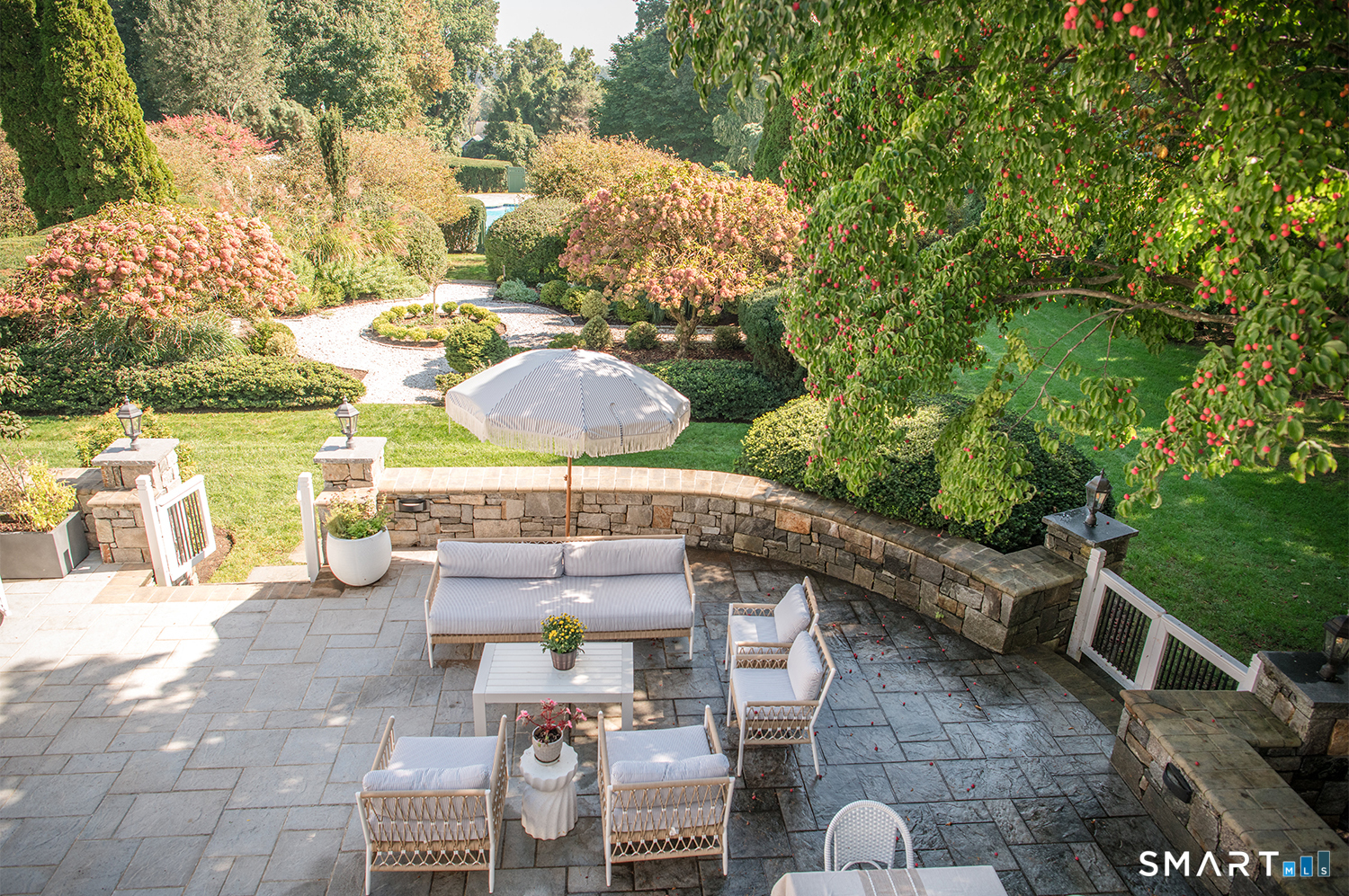 775 Sasco Hill Road Fairfield, CT 06824 - Photo 4 of 36 a terrace with outdoor seating and trees