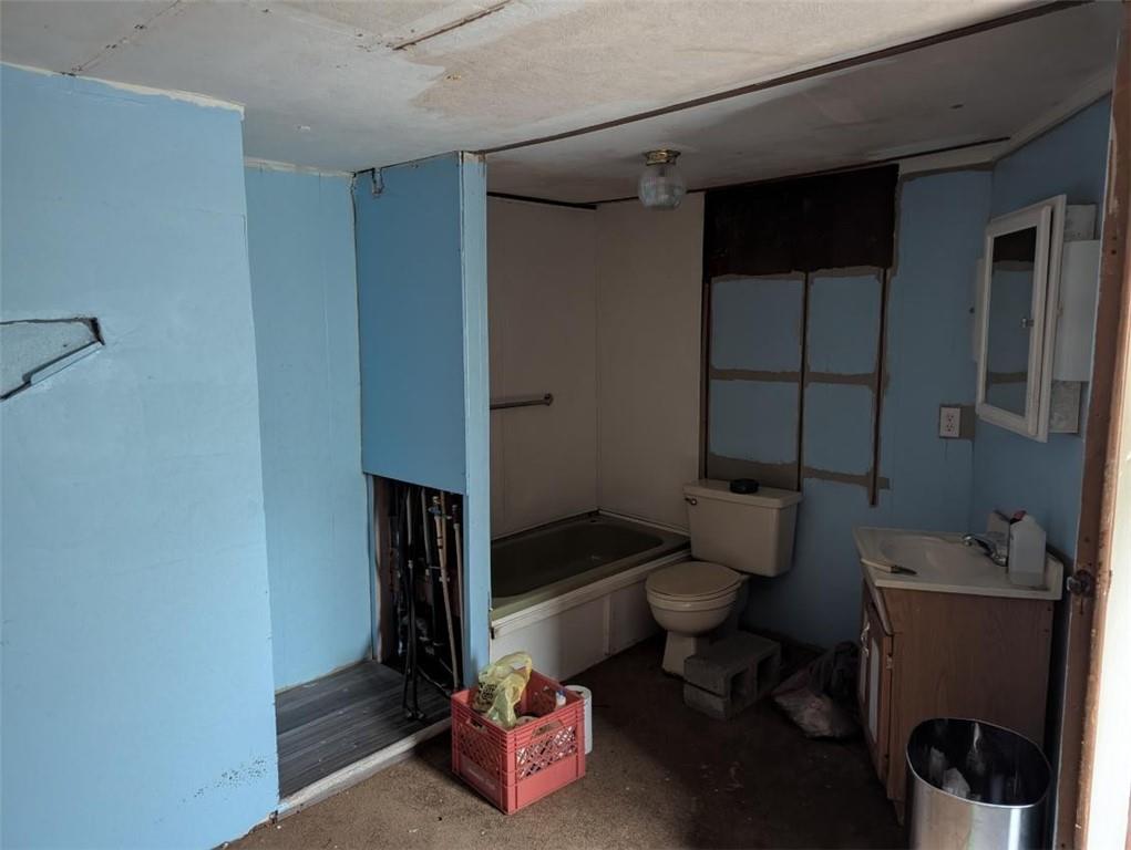 1172 Midway Road Northwest Resaca, GA 30735 - Photo 10 of 25 a bathroom with a sink and a toilet