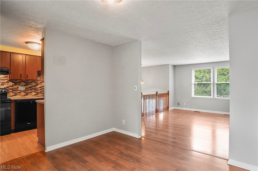 4252 Hile Road Stow, OH 44224 - Photo 10 of 31 Spare room with light hardwood flooring and a textured ceiling