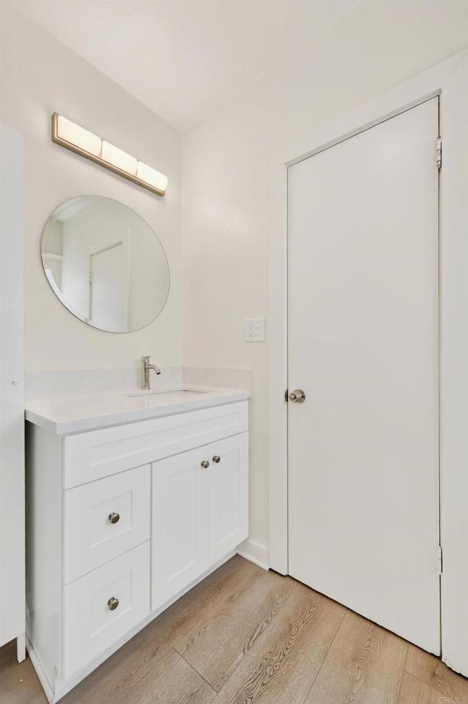 1530 East Appleton Street Long Beach, CA 90802 - Photo 40 of 61 a bathroom with a double vanity sink and a mirror
