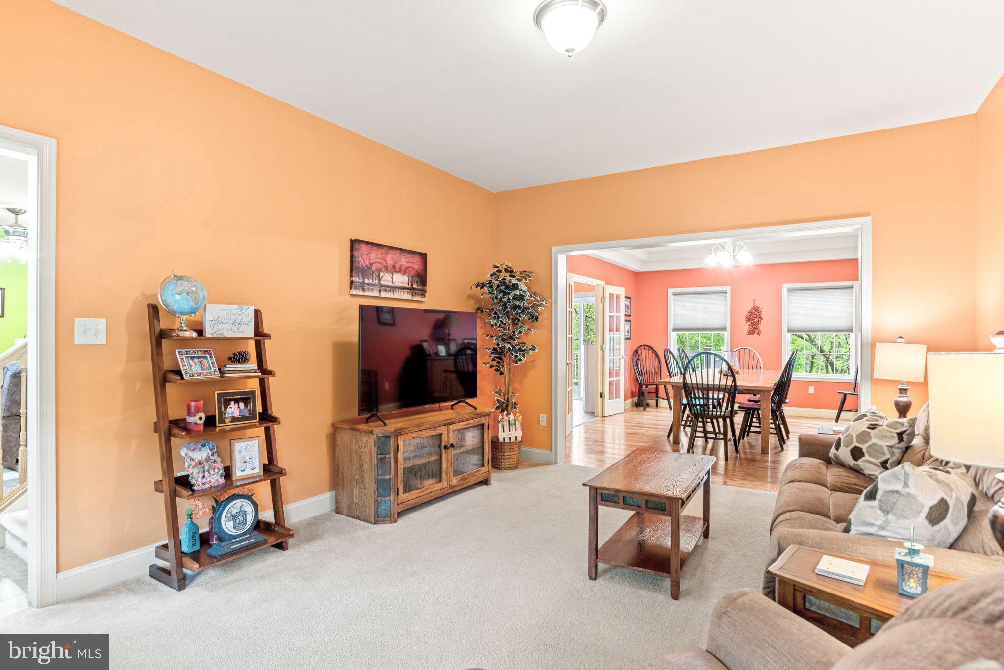 159 Dividing Ridge Road Halifax, PA 17032 - Photo 11 of 57 a living room with furniture a flat screen tv and a floor to ceiling window