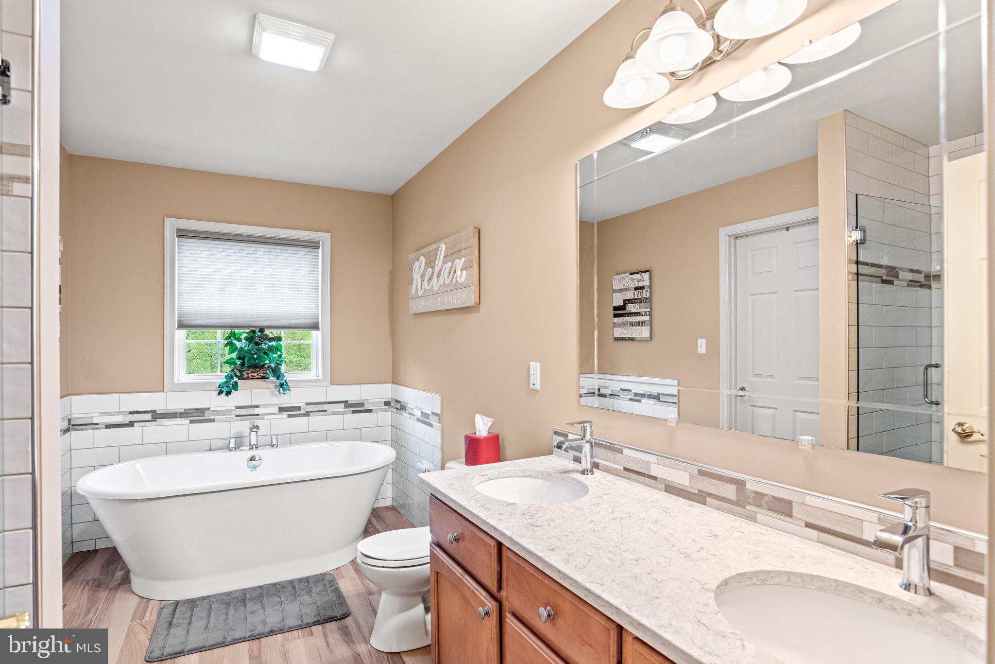 159 Dividing Ridge Road Halifax, PA 17032 - Photo 25 of 57 a bathroom with a granite countertop double vanity sink mirror and toilet