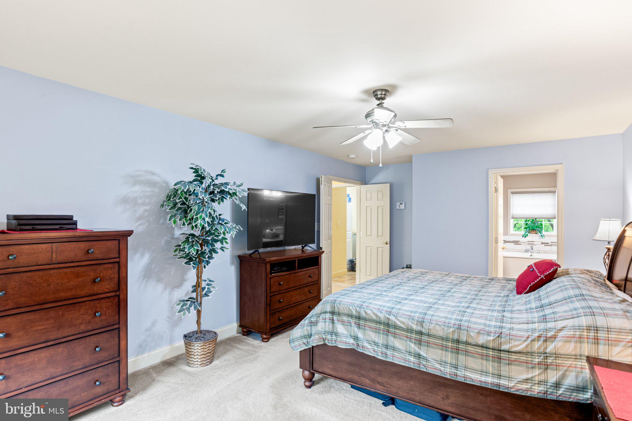 159 Dividing Ridge Road Halifax, PA 17032 - Photo 29 of 57 a bedroom with a bed and a flat screen tv