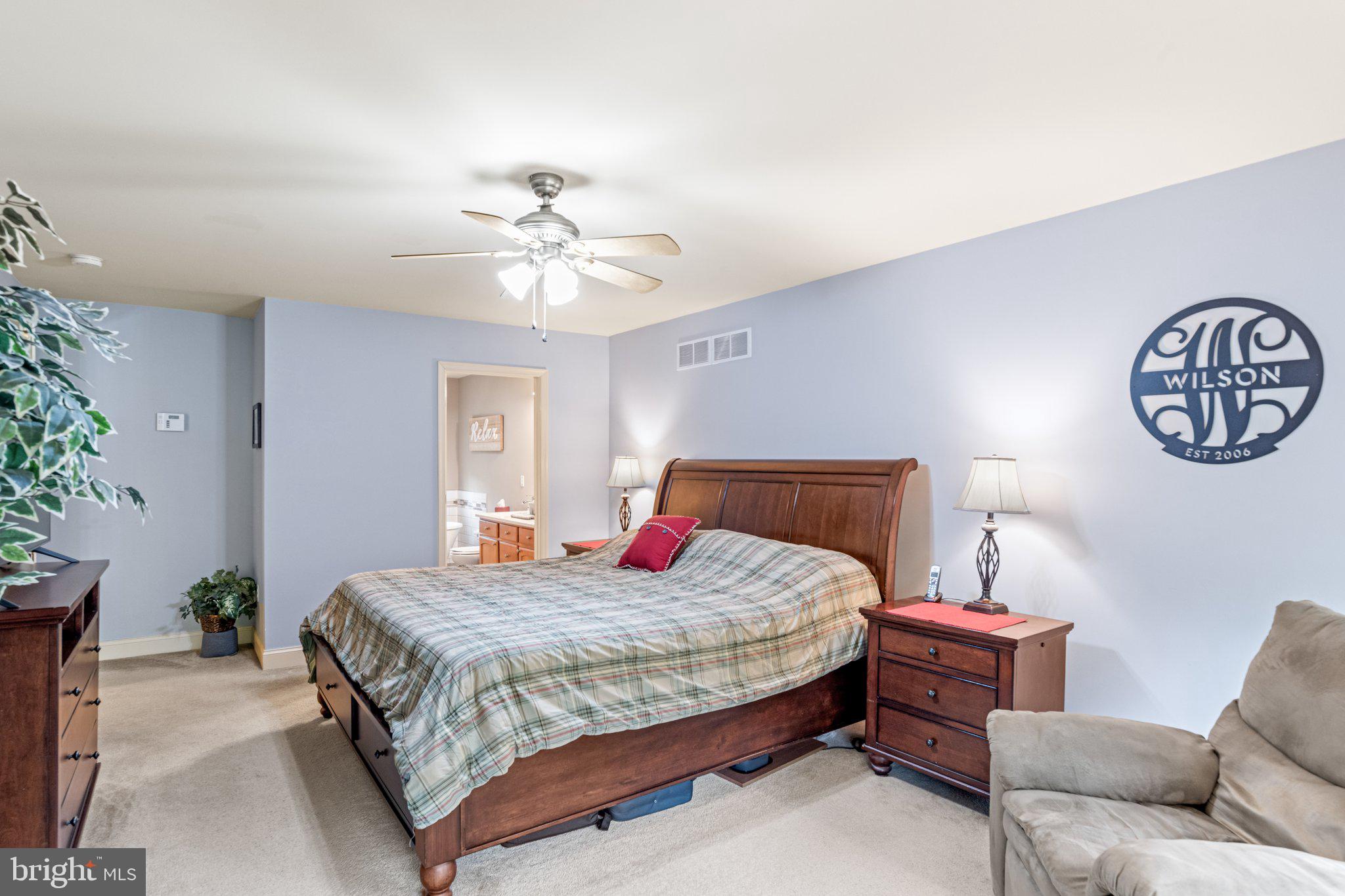 159 Dividing Ridge Road Halifax, PA 17032 - Photo 30 of 57 a bedroom with a bed and a chandelier