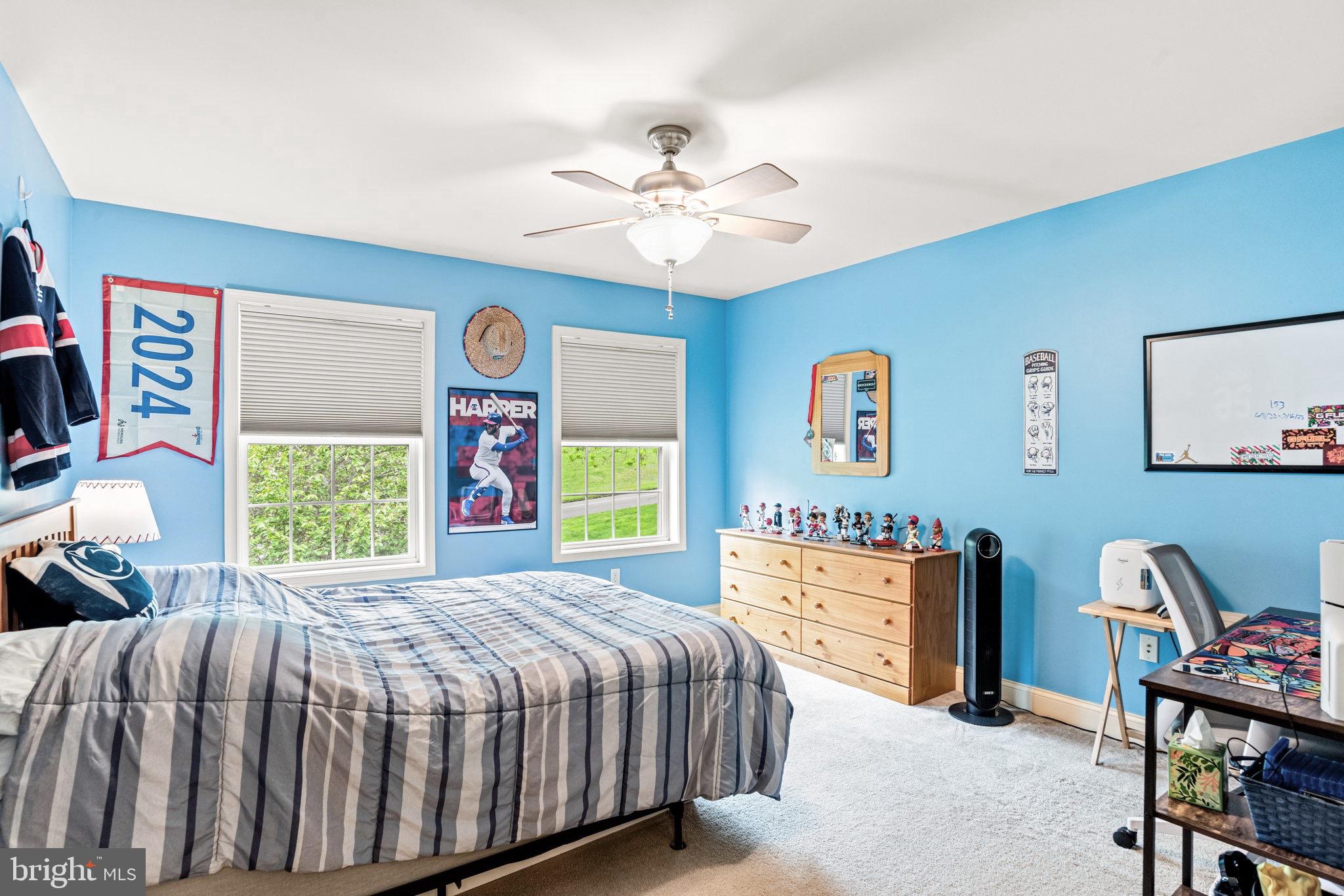 159 Dividing Ridge Road Halifax, PA 17032 - Photo 36 of 57 a bedroom with a bed and a chandelier