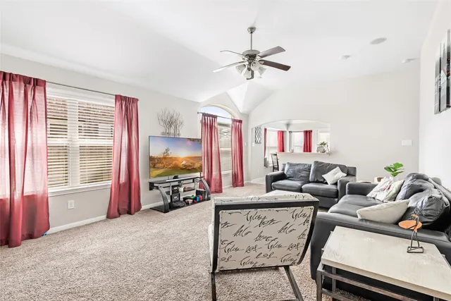 a living room with furniture and window