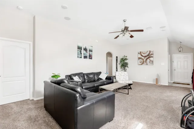 a kitchen with a refrigerator and a sink