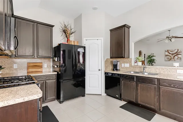 a kitchen with a table and chairs in it