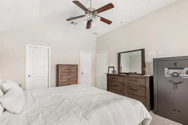 a bathroom with a granite countertop sink shower and a mirror