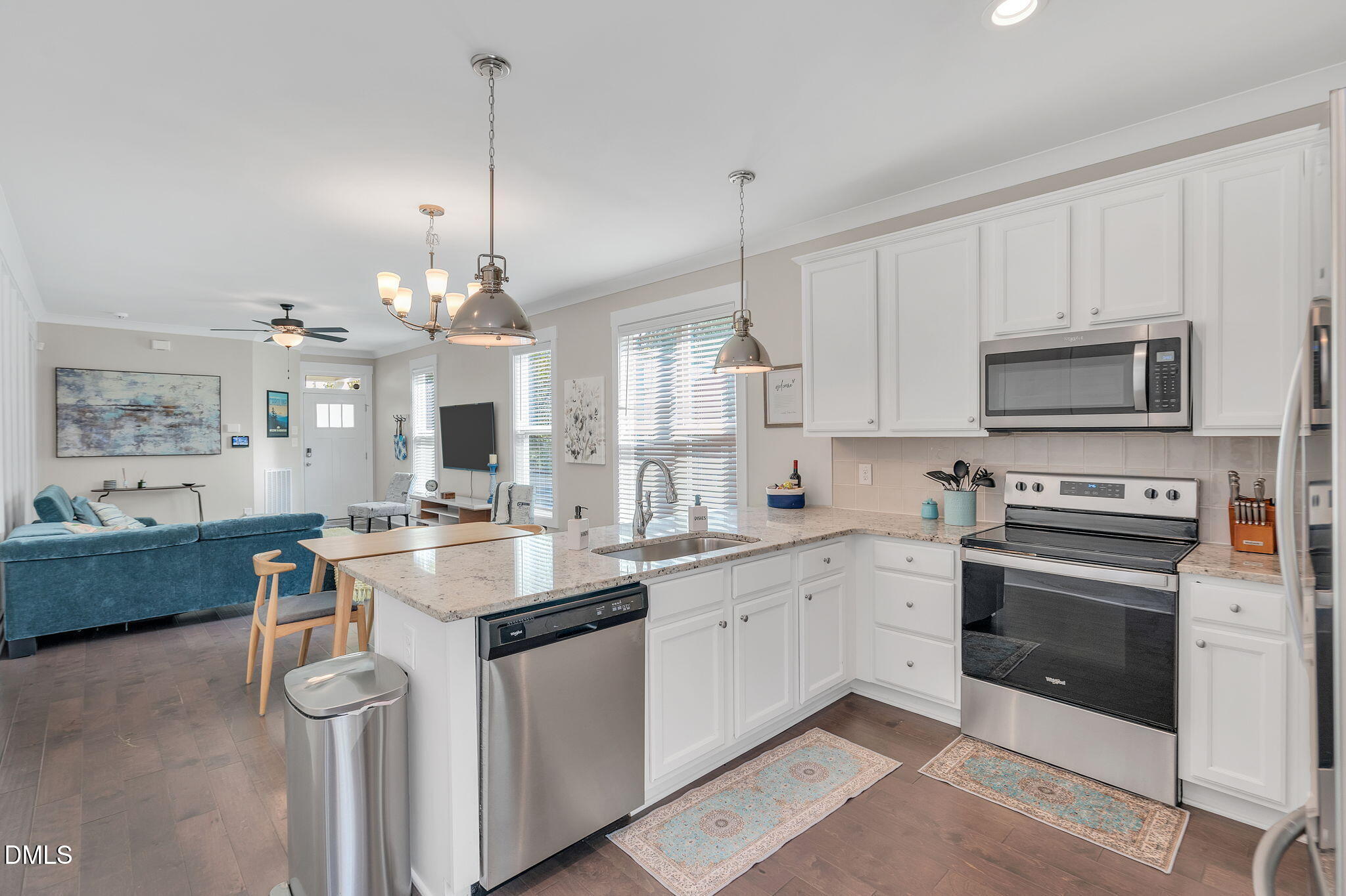 510 Eugene Street Durham, NC 27701 - Photo 15 of 42 a kitchen with a sink stove and microwave