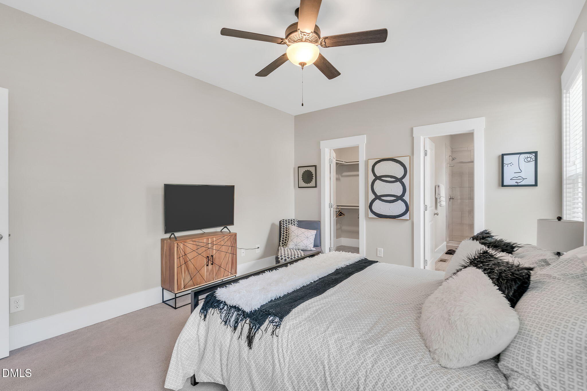 510 Eugene Street Durham, NC 27701 - Photo 20 of 42 a bedroom with a bed and a chandelier