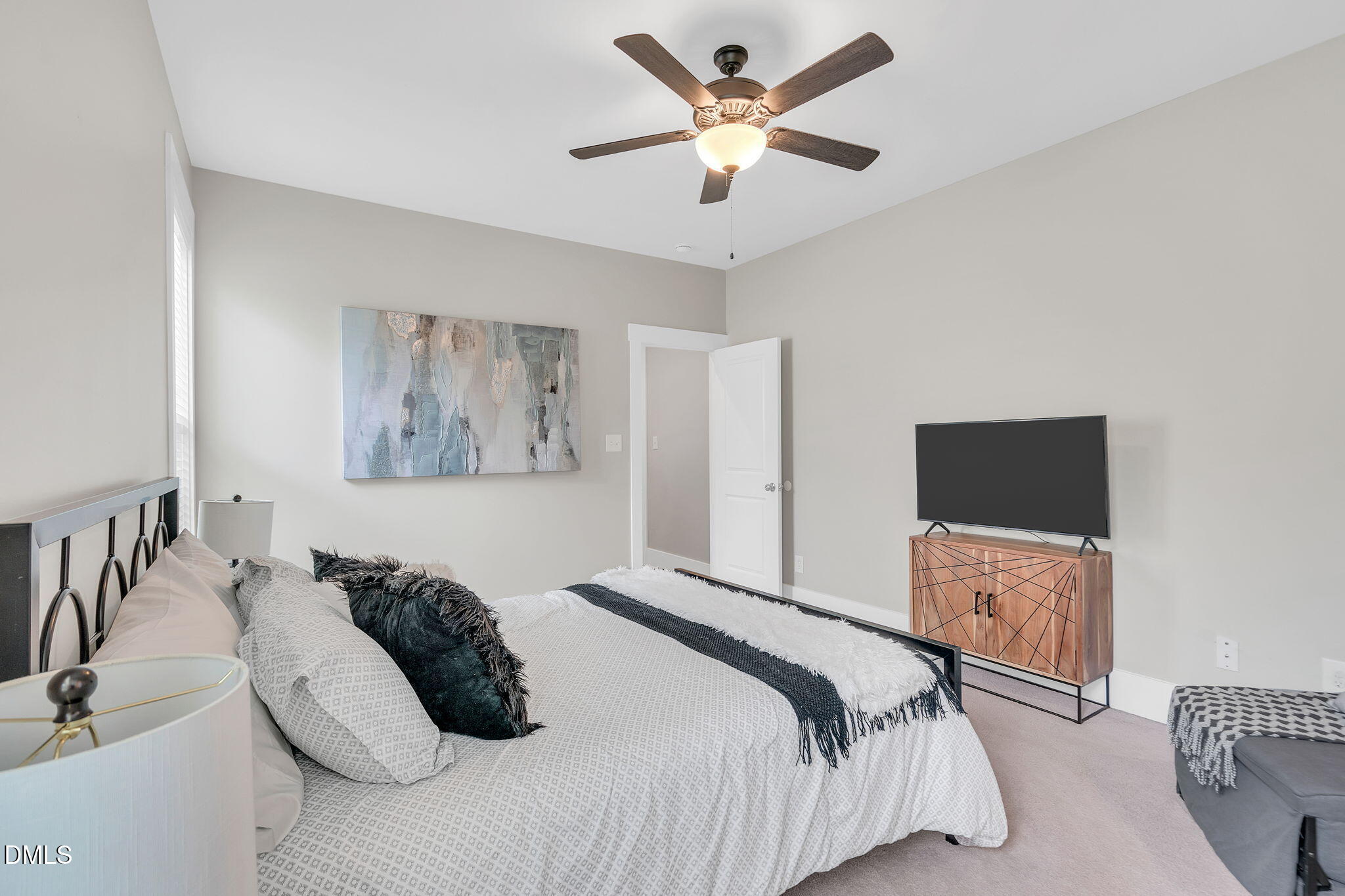 510 Eugene Street Durham, NC 27701 - Photo 22 of 42 a bedroom with a bed and a flat screen tv