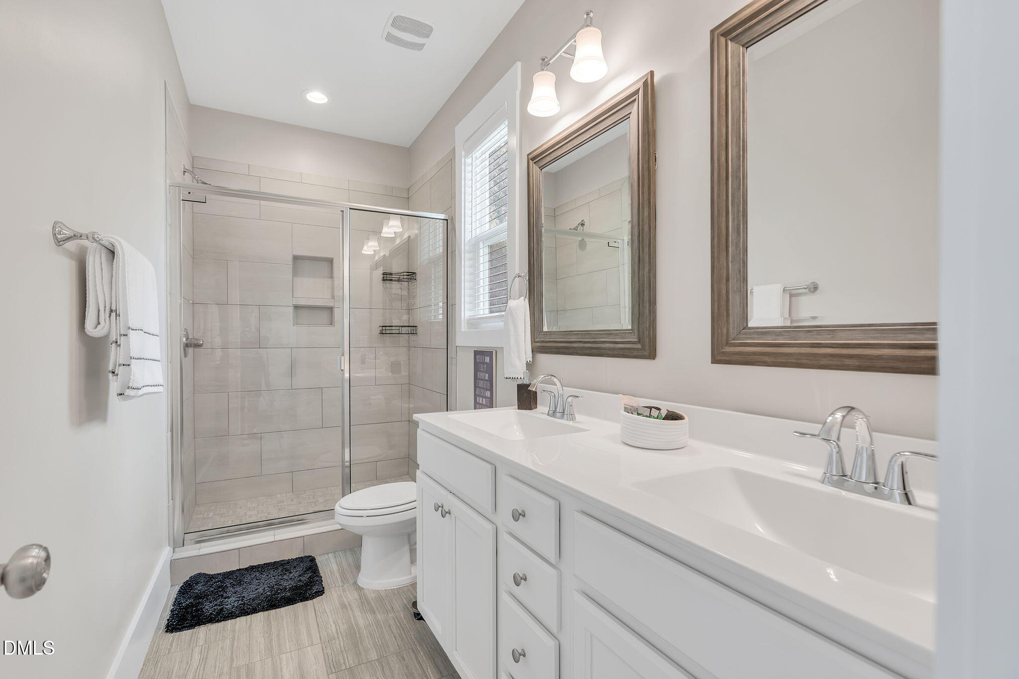 510 Eugene Street Durham, NC 27701 - Photo 24 of 42 a bathroom with a sink a toilet and shower