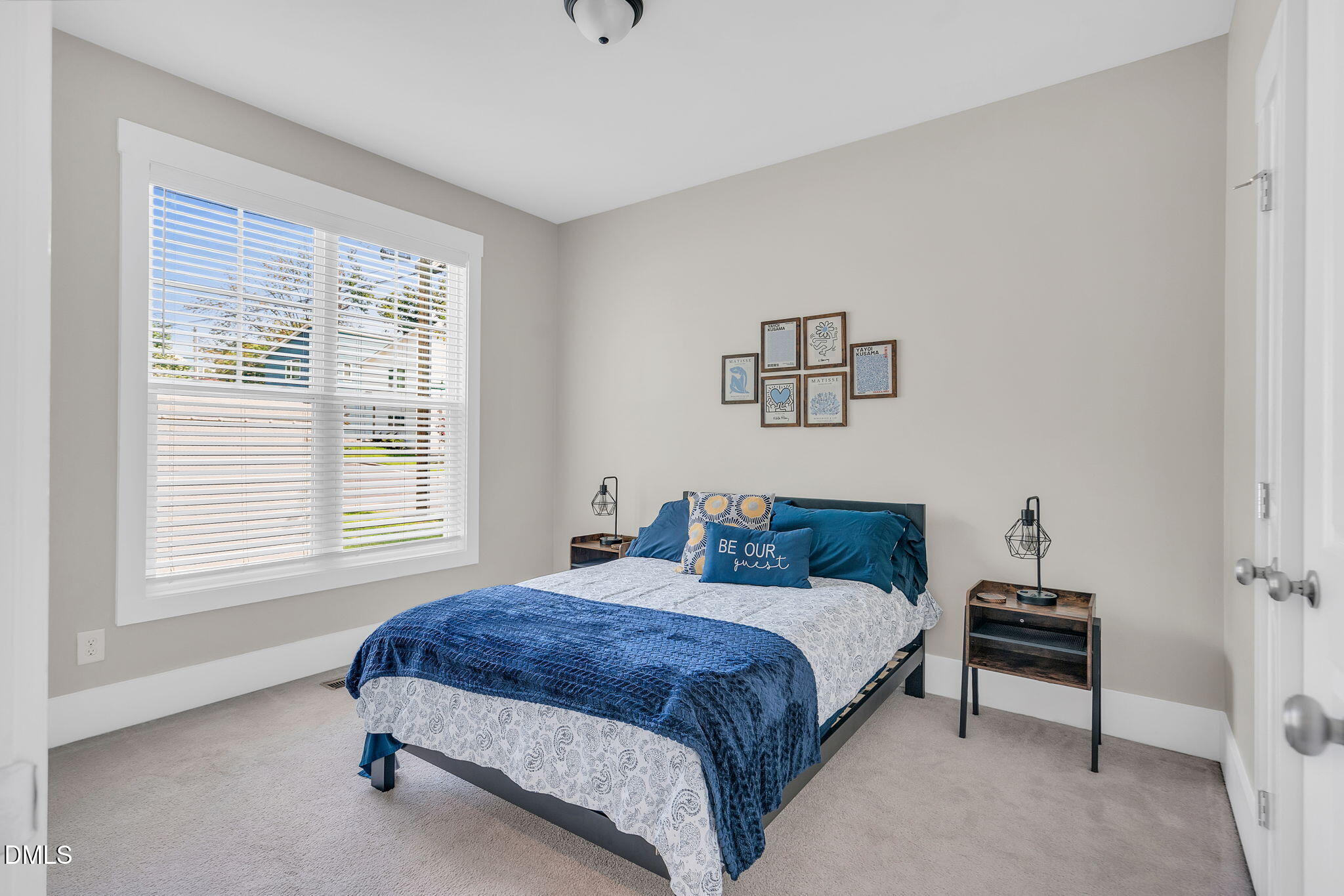 510 Eugene Street Durham, NC 27701 - Photo 27 of 42 a bedroom with a bed and a window
