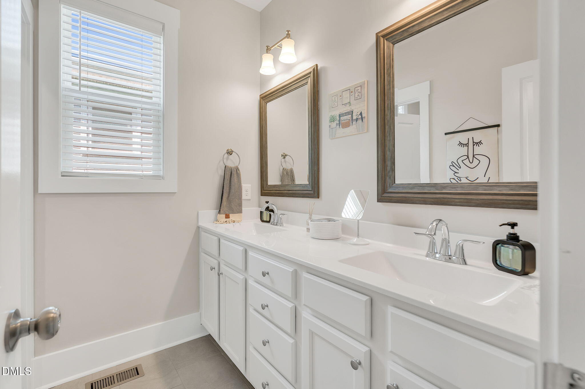 510 Eugene Street Durham, NC 27701 - Photo 29 of 42 a bathroom with a sink and a mirror
