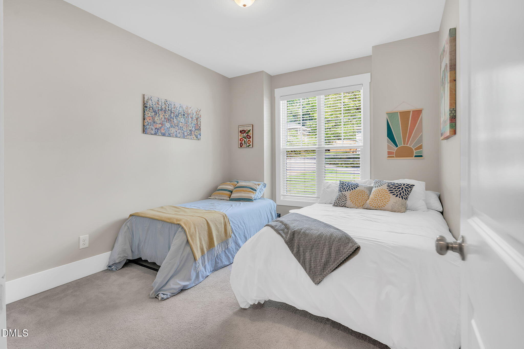 510 Eugene Street Durham, NC 27701 - Photo 32 of 42 a bedroom with two beds and a window