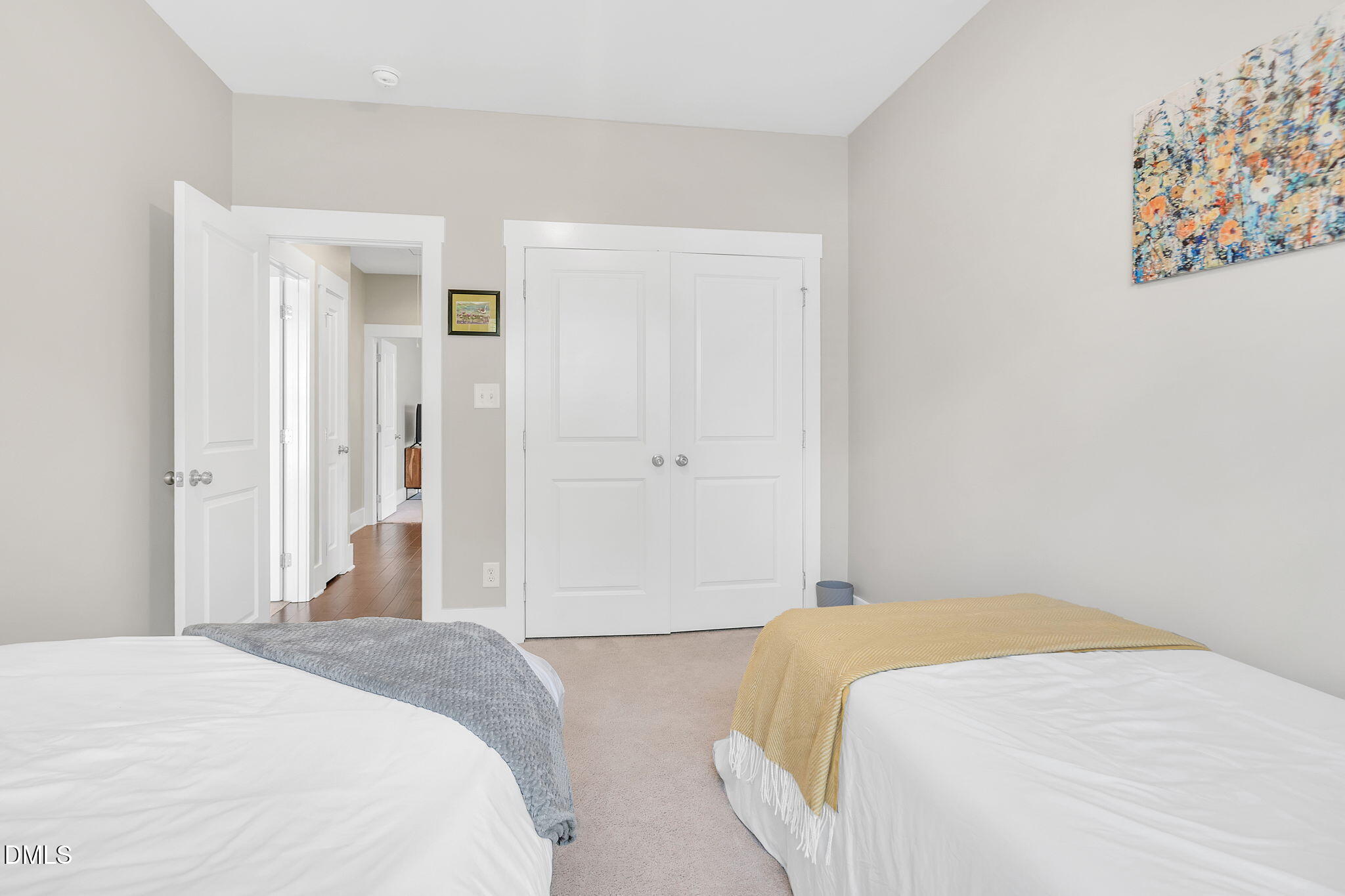 510 Eugene Street Durham, NC 27701 - Photo 33 of 42 a bedroom with a bed and painting on the wall
