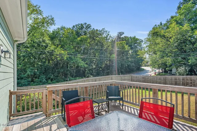 a view of a two chairs in the balcony