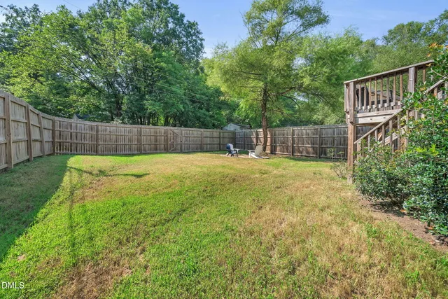 a swimming pool with some trees in the background