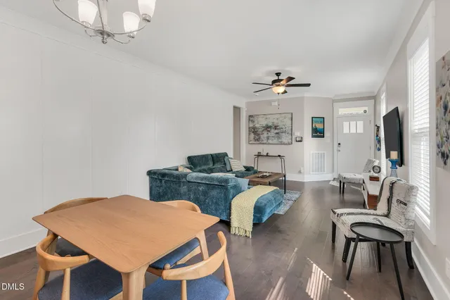 a view of a livingroom with furniture and a table