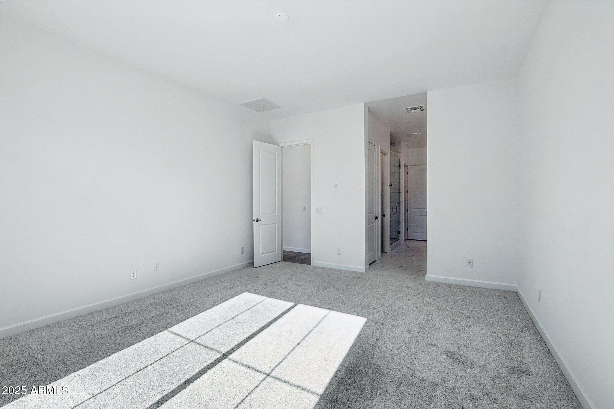 22725 East Saddle Way Queen Creek, AZ 85142 - Photo 27 of 48 an empty room with a natural light