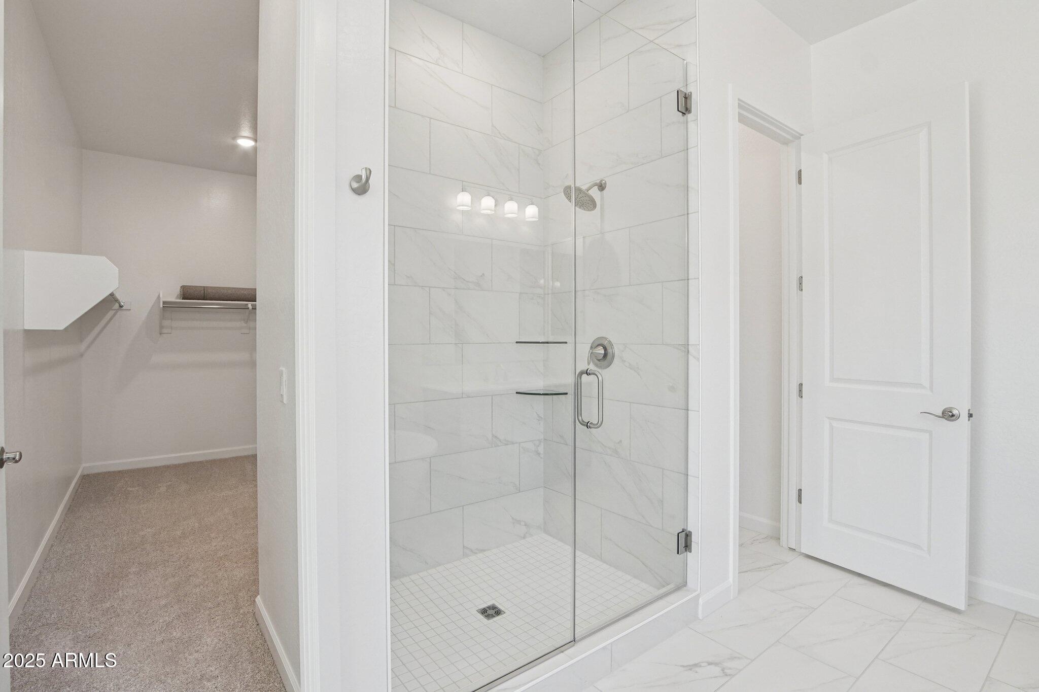 22725 East Saddle Way Queen Creek, AZ 85142 - Photo 29 of 48 a bathroom with a shower