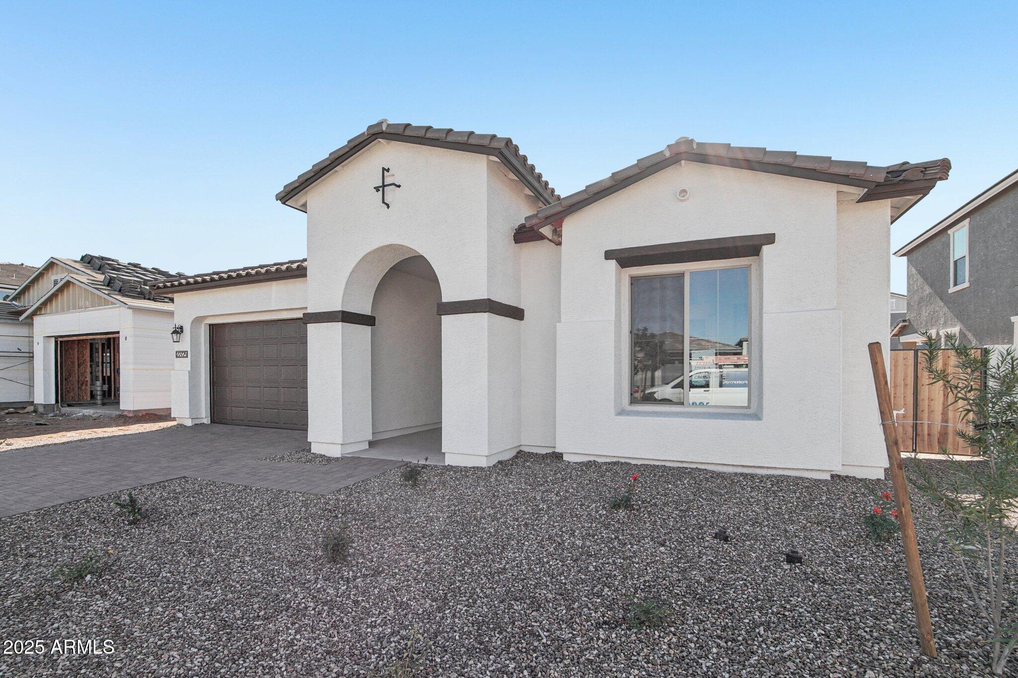 22725 East Saddle Way Queen Creek, AZ 85142 - Photo 3 of 48 a view of a house with a yard