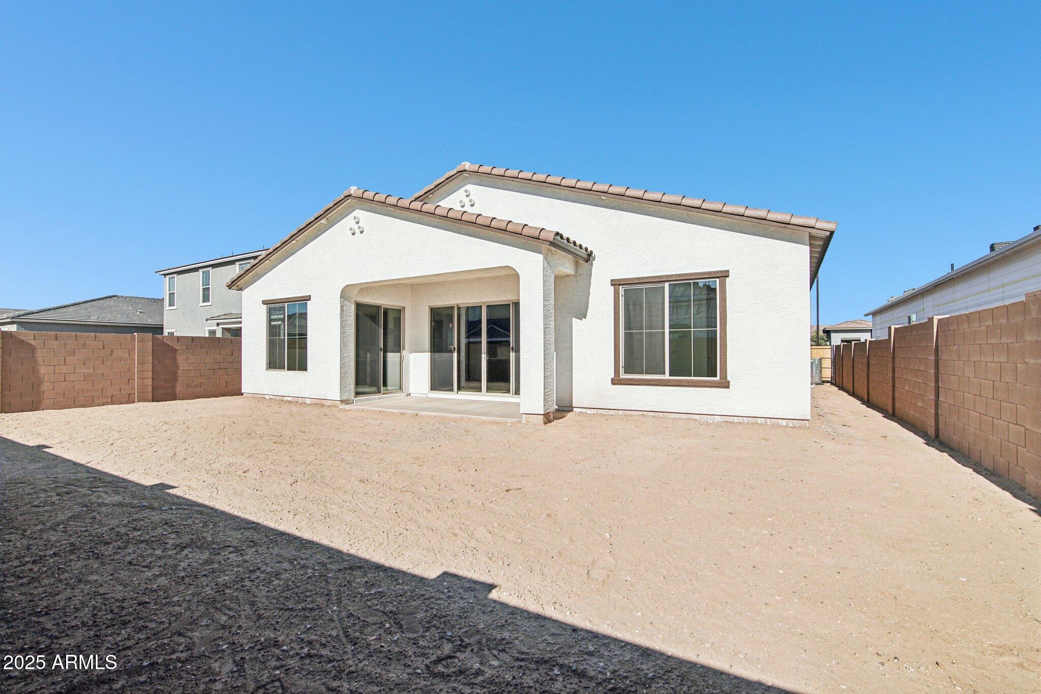 22725 East Saddle Way Queen Creek, AZ 85142 - Photo 35 of 48 a view of a house with a backyard