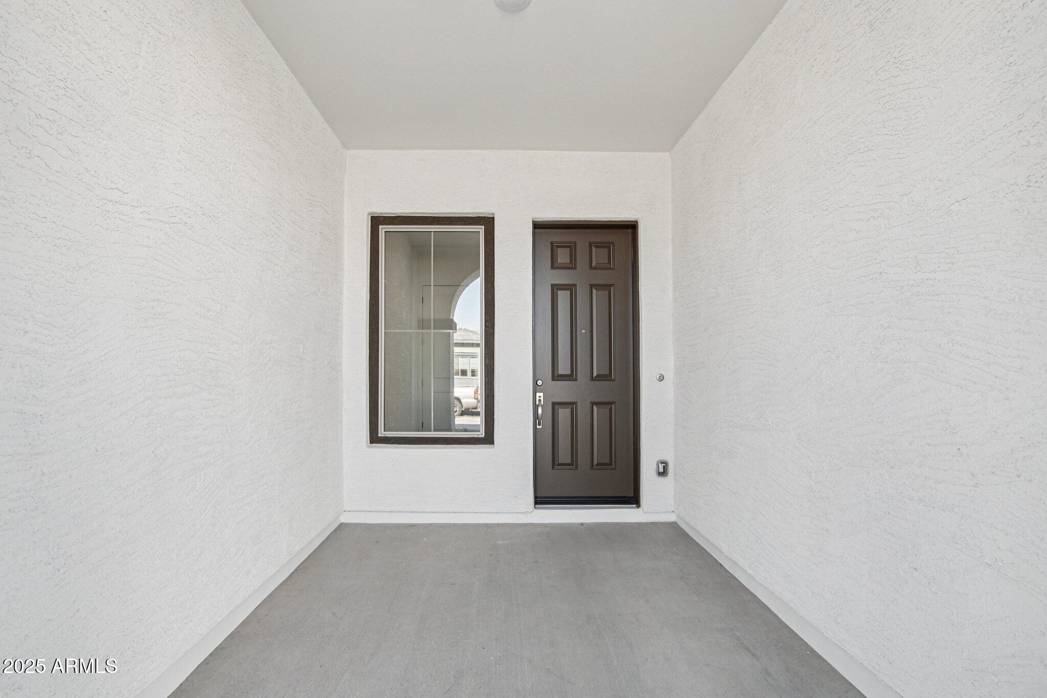 22725 East Saddle Way Queen Creek, AZ 85142 - Photo 4 of 48 an empty room with windows and closet