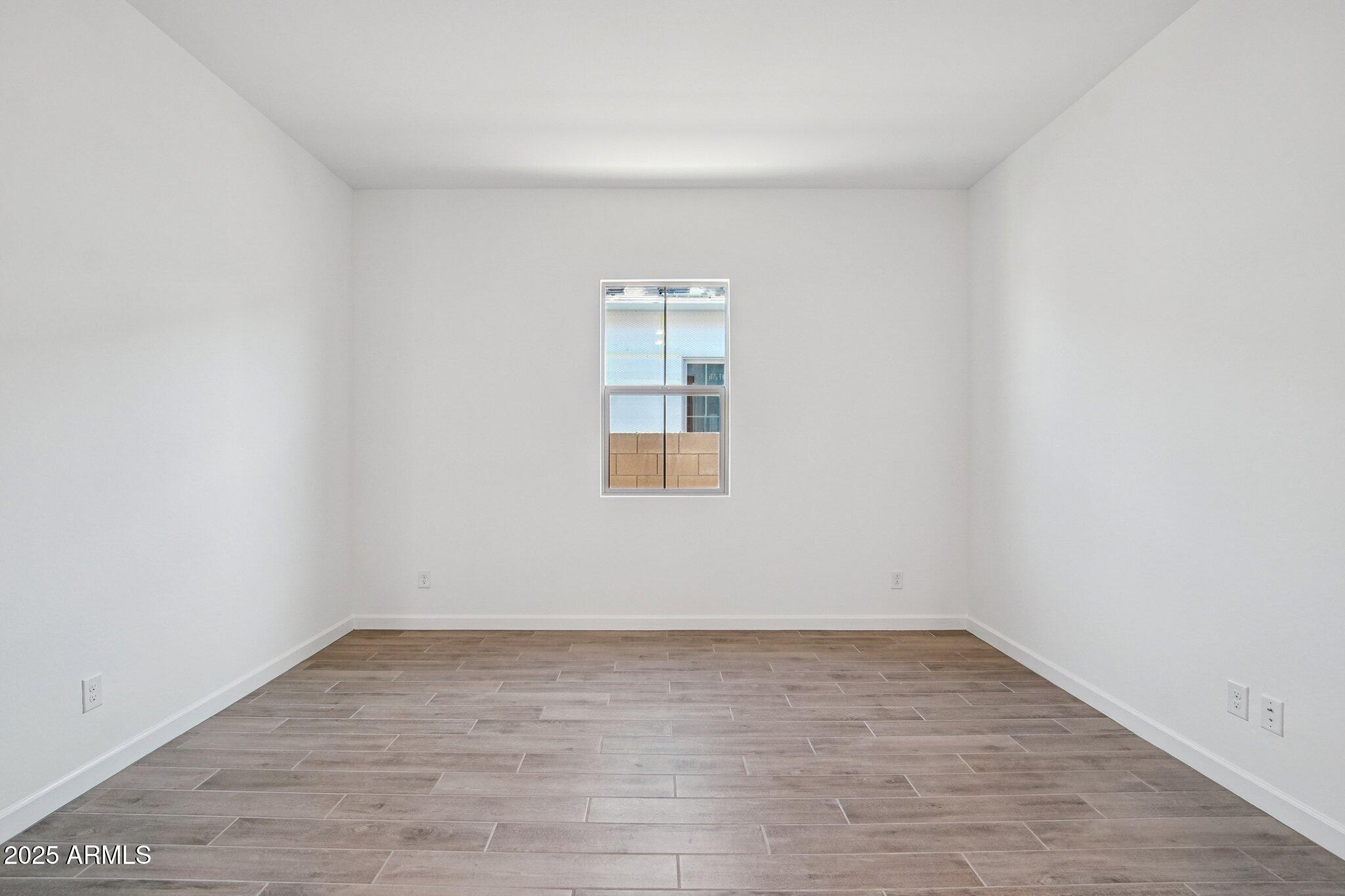 22725 East Saddle Way Queen Creek, AZ 85142 - Photo 5 of 48 wooden floor in an empty room