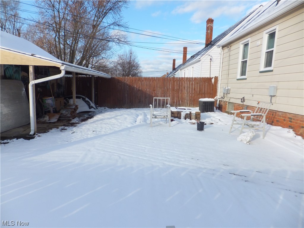 4408 Fulton Road Cleveland, OH 44144 - Photo 20 of 22 Snow covered patio featuring central AC unit