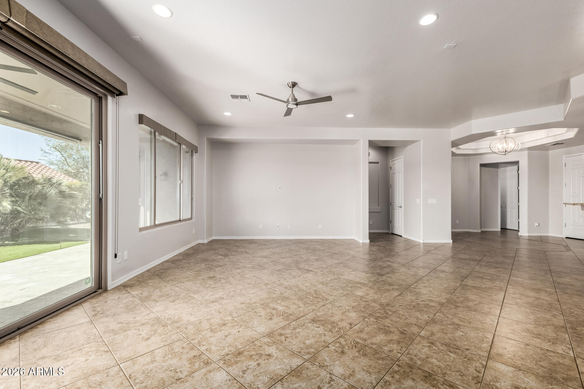 27119 West Burnett Road Buckeye, AZ 85396 - Photo 13 of 56 a view of an empty room with a window