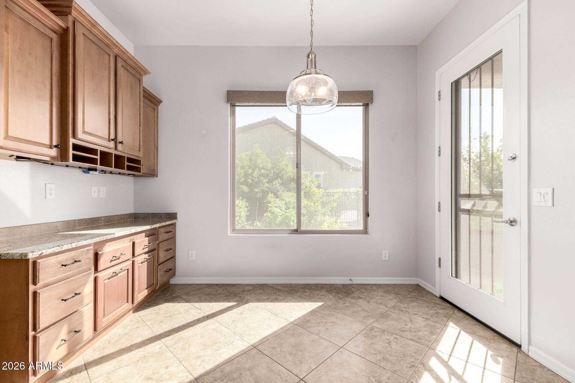 27119 West Burnett Road Buckeye, AZ 85396 - Photo 18 of 56 a kitchen with stainless steel appliances granite countertop a stove a sink and a refrigerator