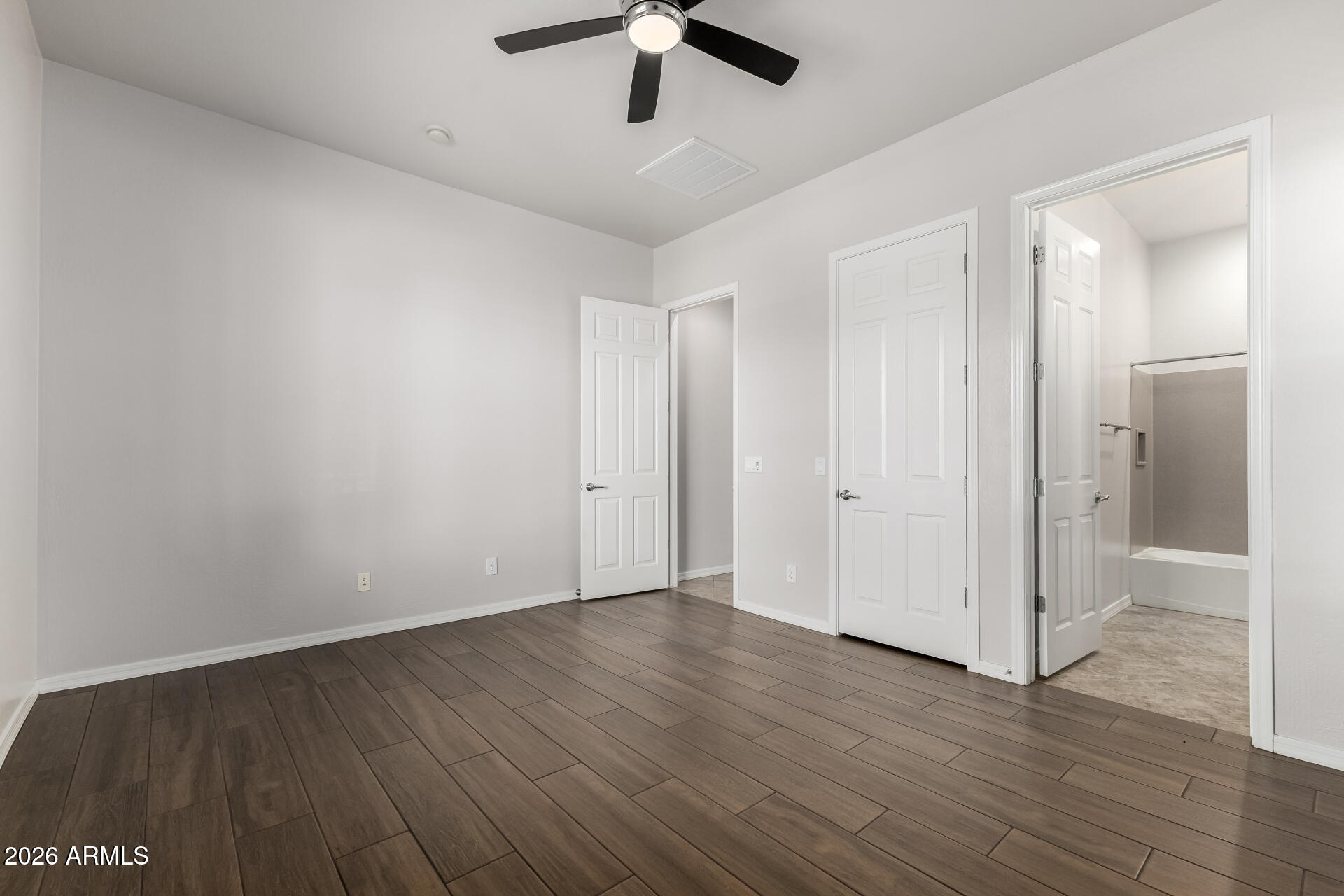 27119 West Burnett Road Buckeye, AZ 85396 - Photo 31 of 56 wooden floor in an empty room