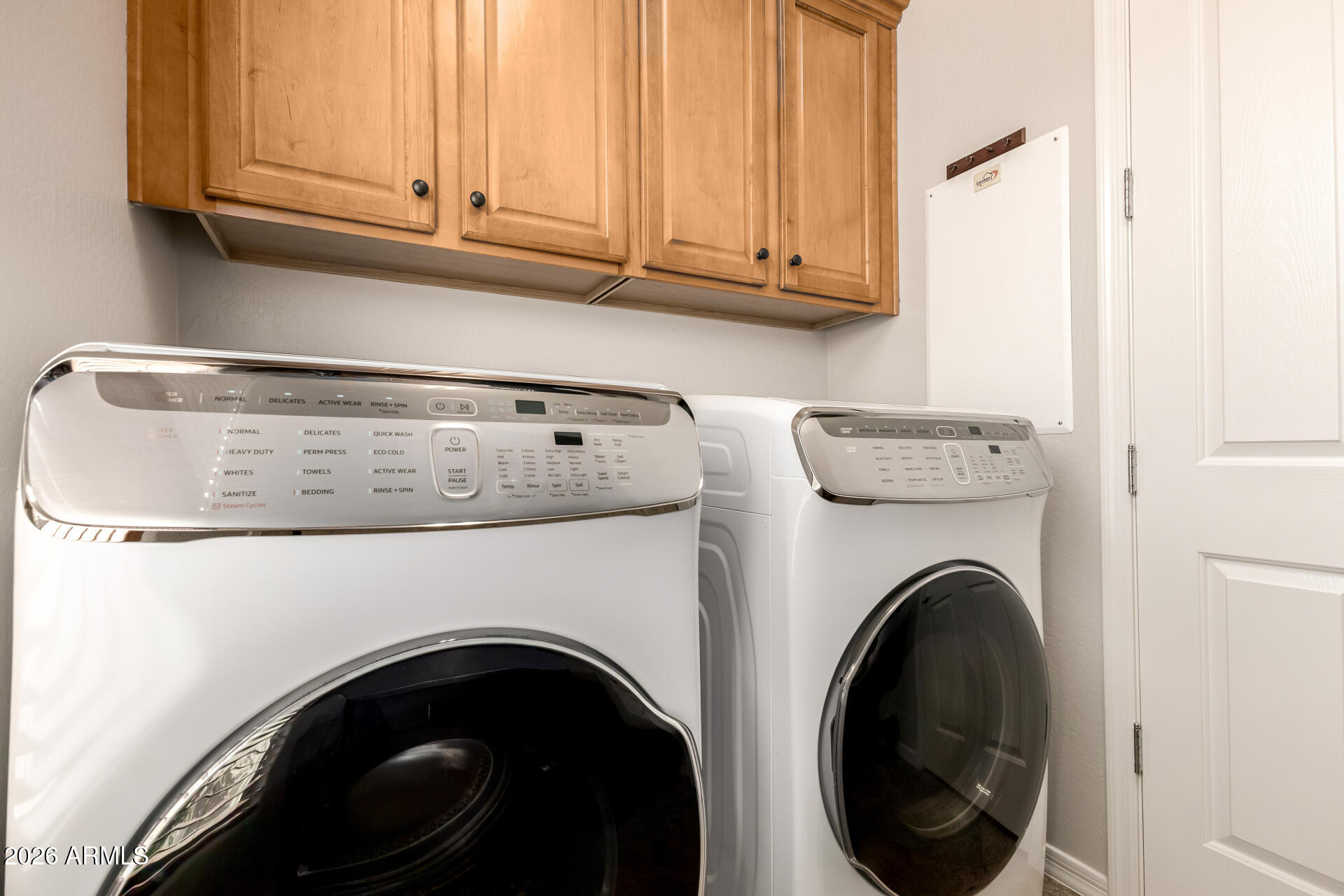 27119 West Burnett Road Buckeye, AZ 85396 - Photo 34 of 56 a utility room with dryer and washer