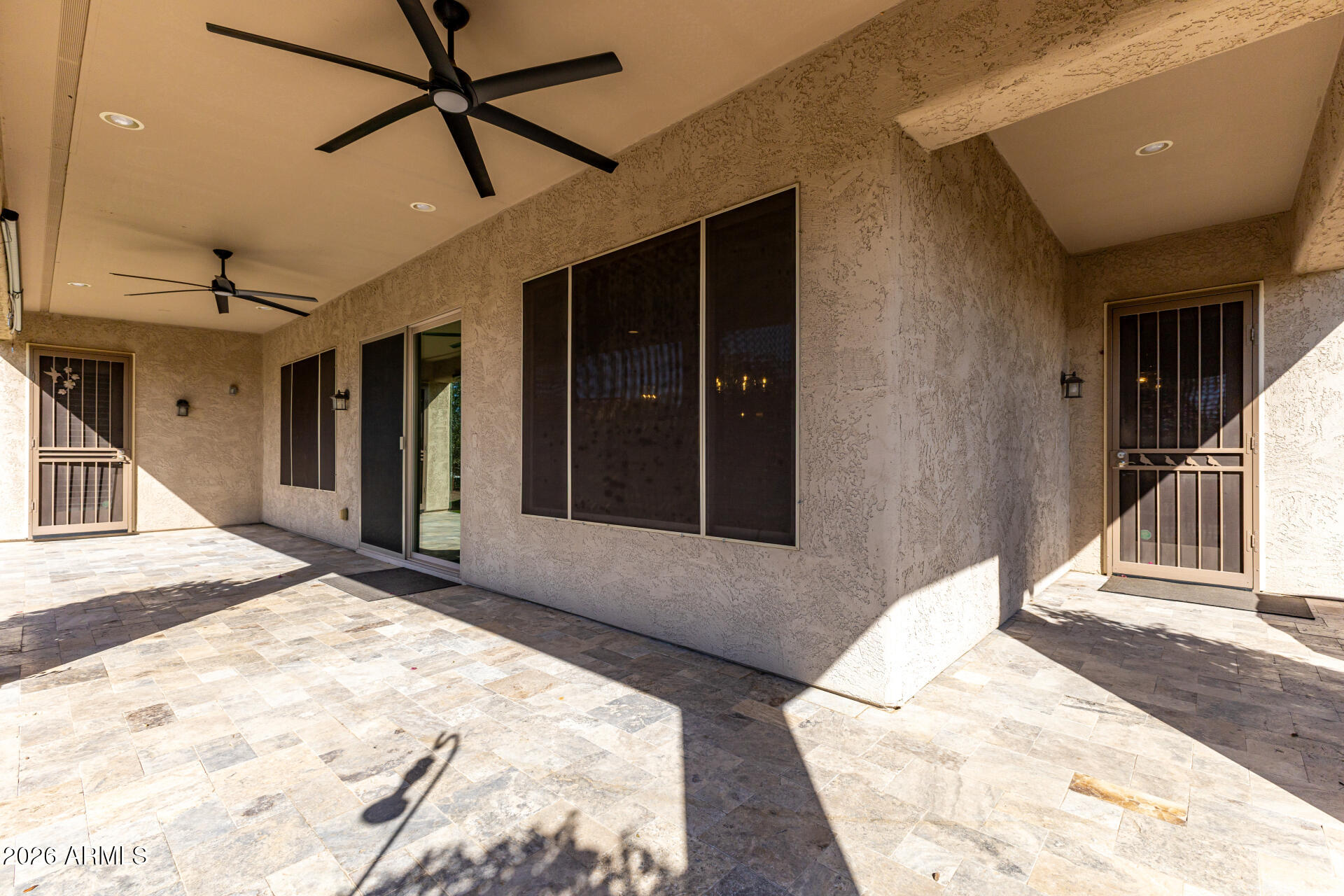 27119 West Burnett Road Buckeye, AZ 85396 - Photo 37 of 56 a view of a hallway with a livingroom and entryway