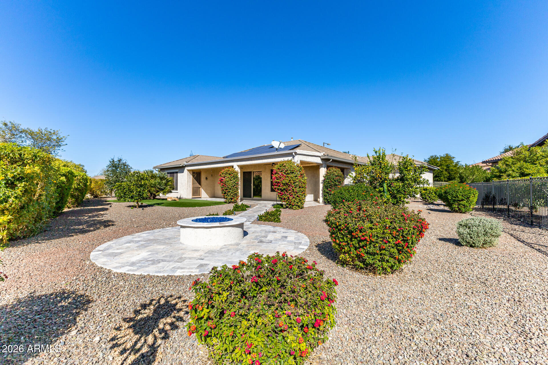 27119 West Burnett Road Buckeye, AZ 85396 - Photo 40 of 56 a front view of a house with a yard