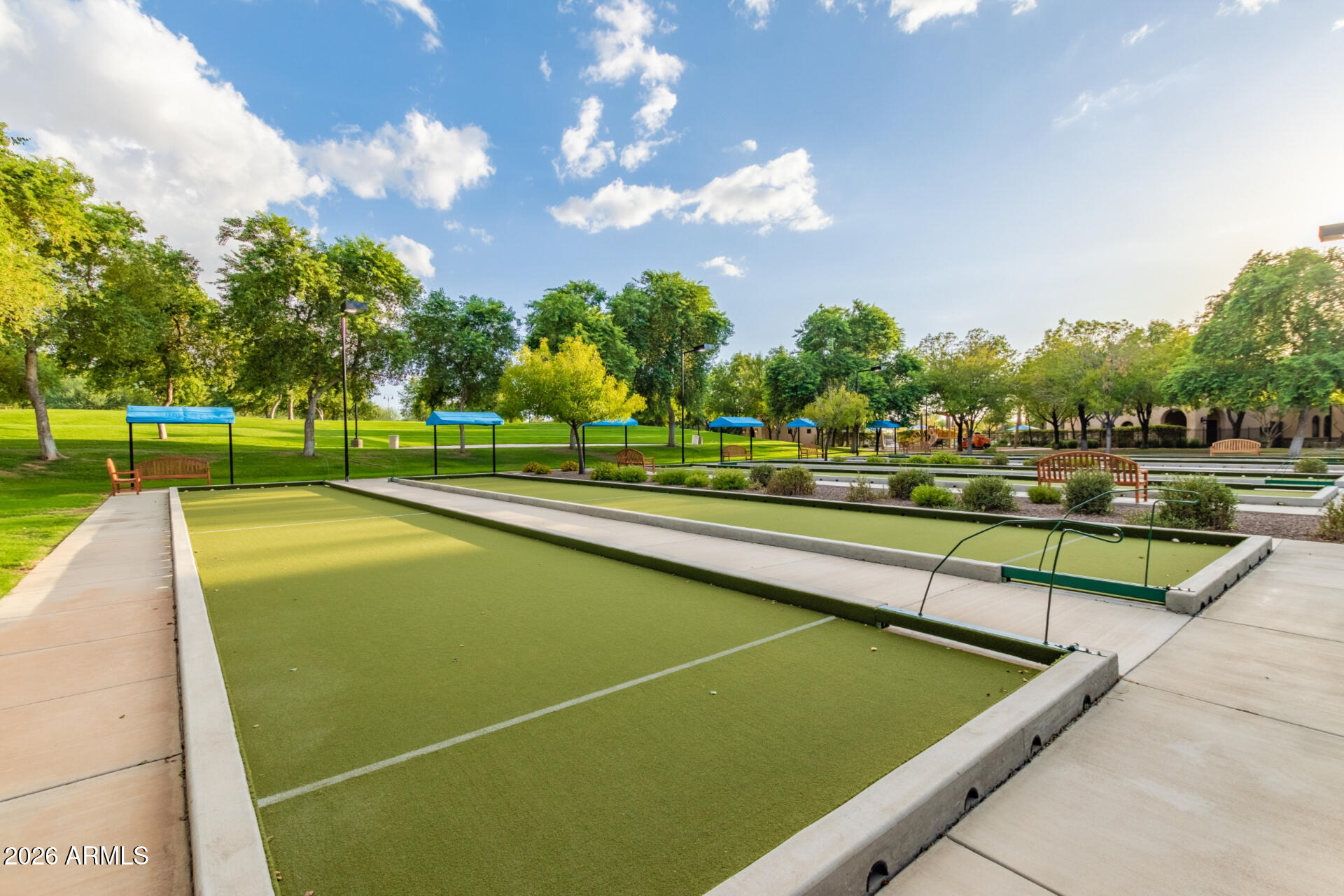 27119 West Burnett Road Buckeye, AZ 85396 - Photo 56 of 56 a view of a swimming pool with a lawn chairs