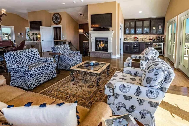 a living room with fireplace furniture and a flat screen tv