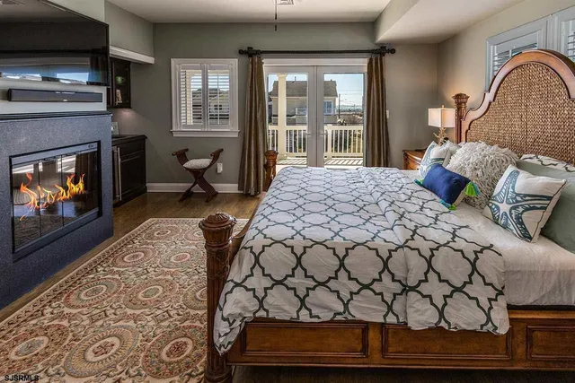 a bedroom with furniture and a fireplace