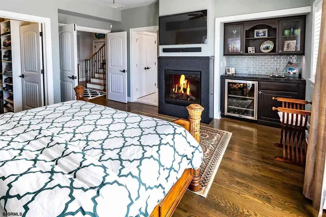 a bed room with furniture and a fireplace