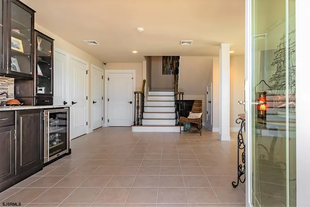 a view of hallway with livingroom and furniture
