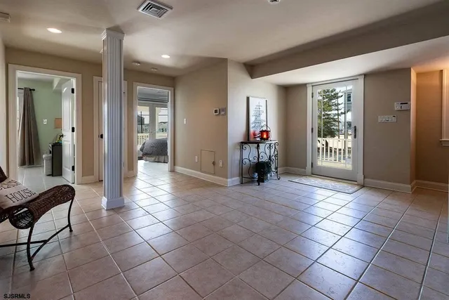 a view of a livingroom with furniture and an entryway