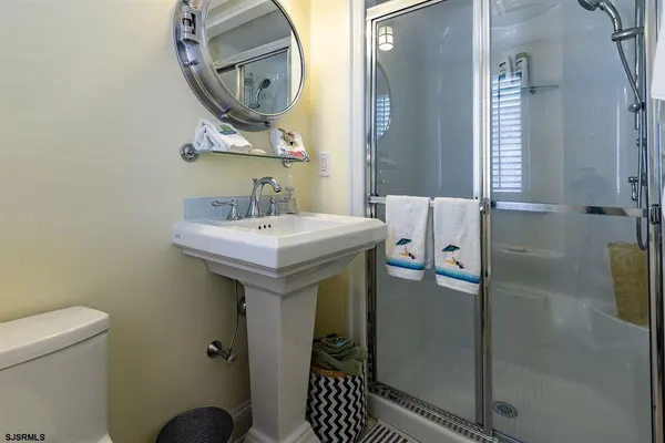 a bedroom with a bed and glass window