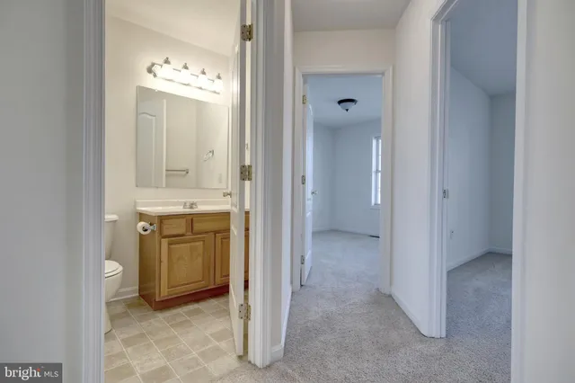 a view of a house with a yard and stairs