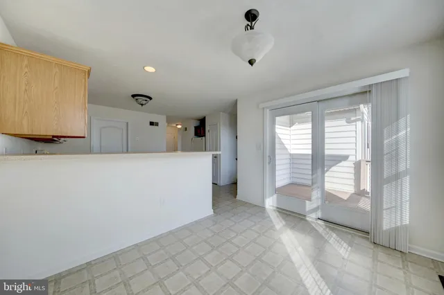 a view of a room with window and hardwood