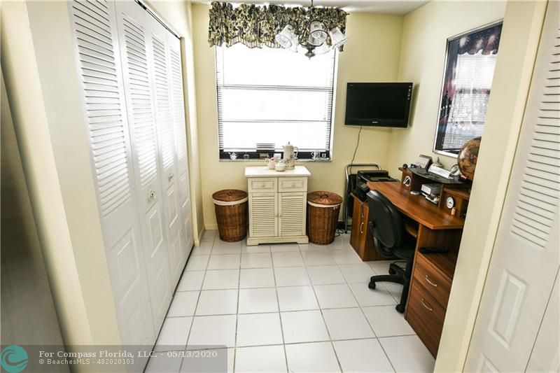 7350 Northwest 18th Street, Unit 101 Margate, FL 33063 - Photo 13 of 28 Breakfast area is currently used as an office. The closet on the left holds the full size washer and dryer.