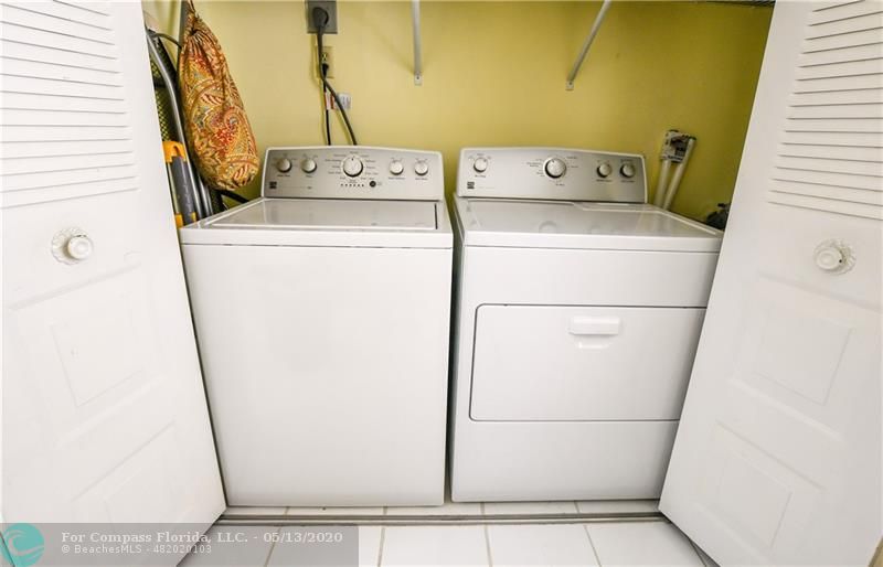 7350 Northwest 18th Street, Unit 101 Margate, FL 33063 - Photo 14 of 28 Full size washer and dryer conveniently located by the kitchen.