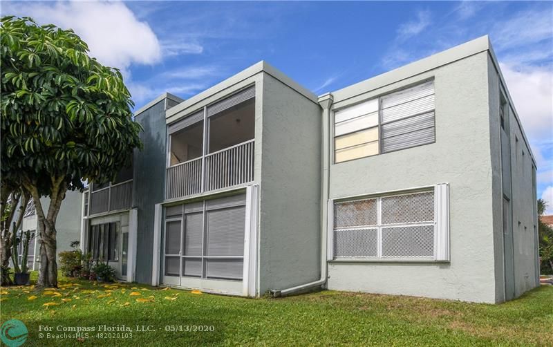 7350 Northwest 18th Street, Unit 101 Margate, FL 33063 - Photo 22 of 28 Accordion shutters on porch, back window and front window for added protection.